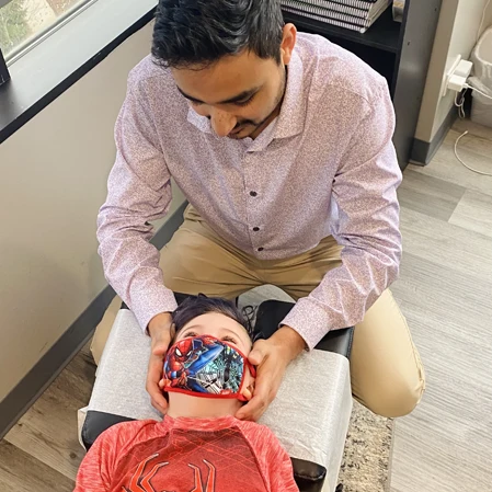 Chiropractor Hoffman Estates IL Ankur Shah Adjusting Neck